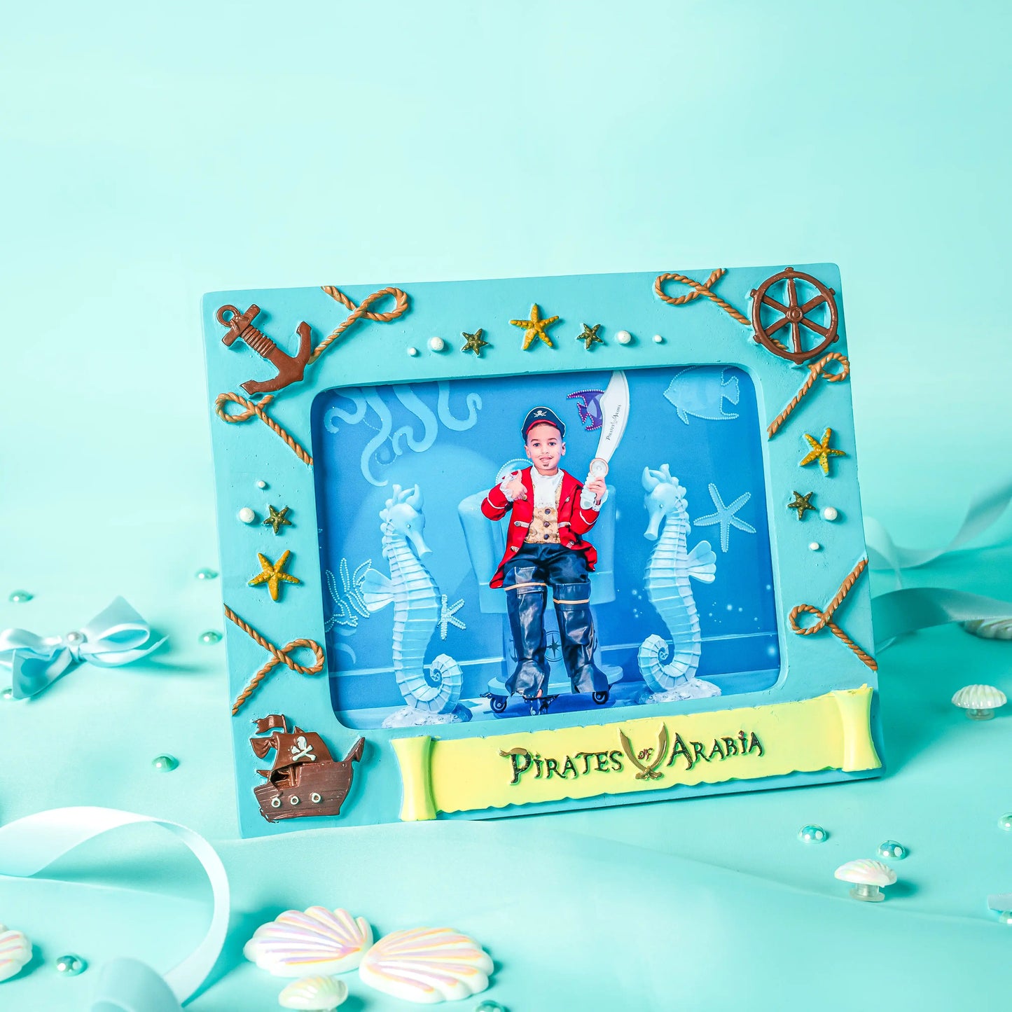 Pirate-themed photo frame with decorative elements on a light blue background