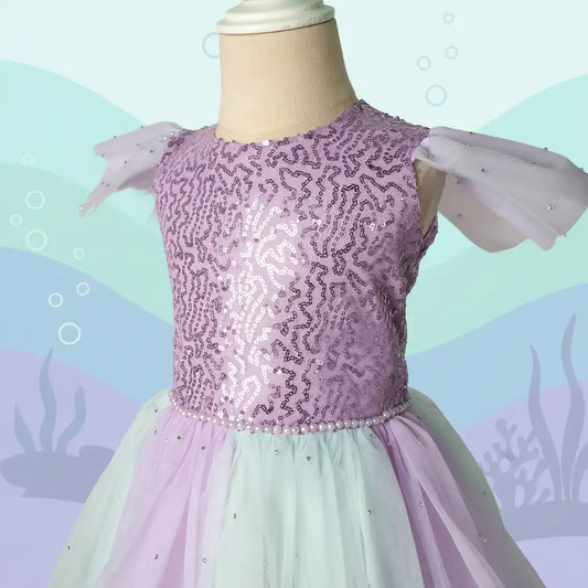 Lavender sequin dress on a mannequin with a pastel underwater background