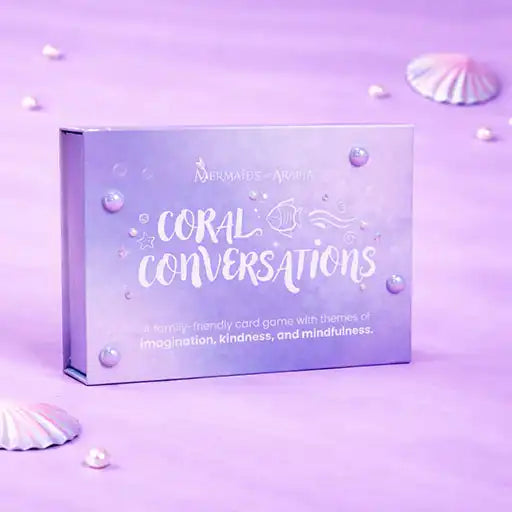 Card game box titled 'Coral Conversations' on a purple background with seashells.