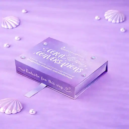 Purple box with text on a purple background with seashells and pearls