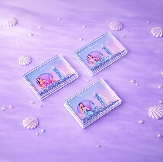 Three rectangular cards with mermaid illustrations on a purple background with shell and pearl decorations.