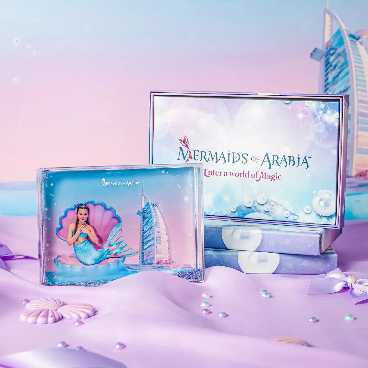 Mermaids of Arabia product packaging with a mermaid illustration and Dubai skyline on a pastel background.