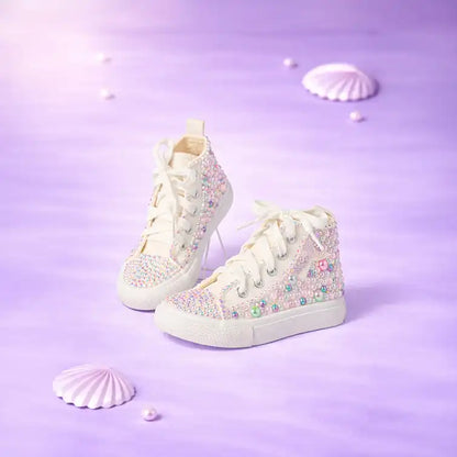 White high-top sneakers with colorful embellishments on a purple background
