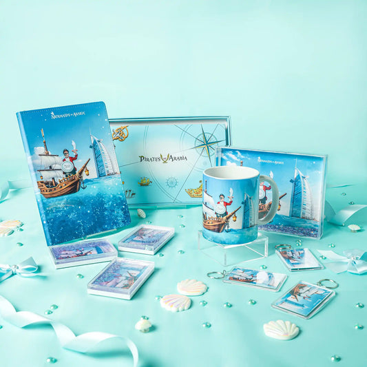 Collection of 'Pirates of the Caribbean' themed merchandise including a mug, cards, and a notebook on a turquoise background.