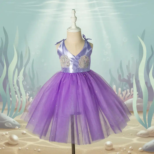 Purple dress on a mannequin with an underwater-themed background